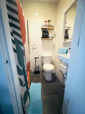 a bathroom with a toilet and a sink at Private room with private bathroom and backyard in Brooklyn