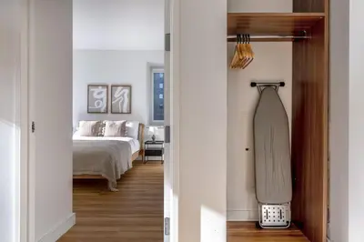 a bedroom with a bed and a skateboard in it at Midtown West 1br w doorman nr rockefeller center NYC-1394 in New York