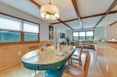 a dining room and living room with a table and chairs at Vacation Rental Home about 2 Mi to Windham Mountain! in Windham