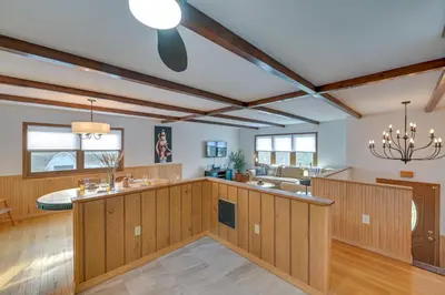 a large kitchen with wood paneling and a ceiling at Vacation Rental Home about 2 Mi to Windham Mountain! in Windham