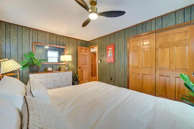 a bedroom with a bed and a ceiling fan at Vacation Rental Home about 2 Mi to Windham Mountain! in Windham