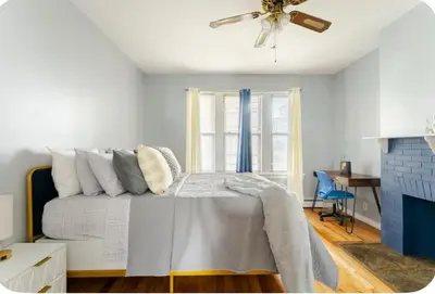 a bedroom with a bed and a ceiling fan at K-Marie Estate in Mount Vernon