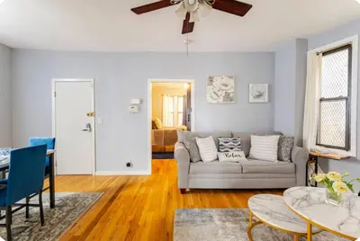 a living room with a couch and a table at K-Marie Estate in Mount Vernon