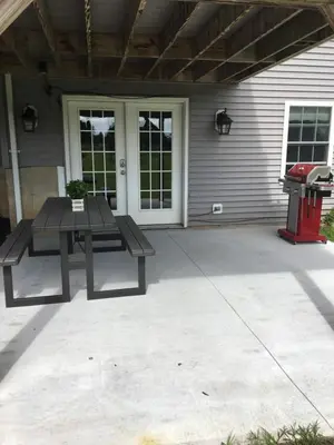 a patio with a picnic table and a grill at Privacy, entertainment, comfort galore 2 BR LR 1BA Home Theater, Pool Table in Suffield