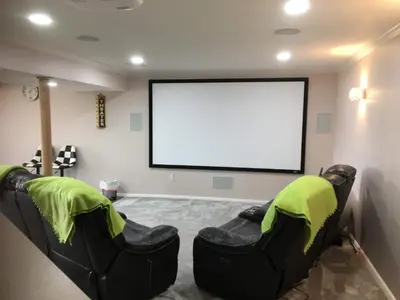a movie room with two chairs in front of a screen at Privacy, entertainment, comfort galore 2 BR LR 1BA Home Theater, Pool Table in Suffield