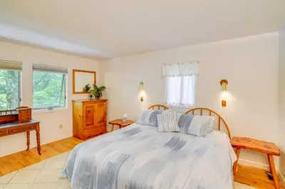 a bedroom with a bed and a piano at Great Barrington Lakeside Getaway with Kayak and Grill in Great Barrington