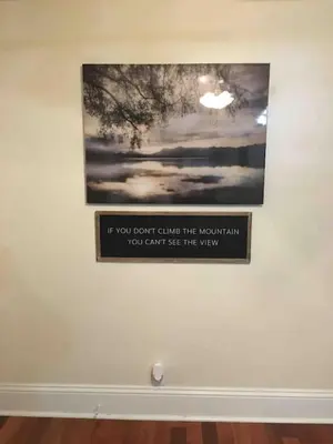 a picture hanging on a wall with a picture at The luxury lounge in Schenectady