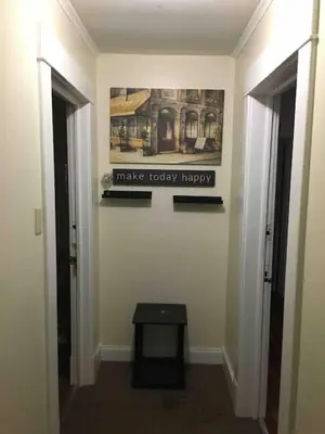 a hallway with two doors and a sign on the wall at The luxury lounge in Schenectady