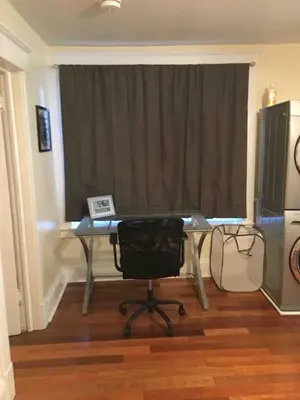 a desk with a chair in front of a window at The luxury lounge in Schenectady
