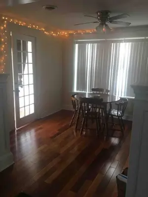 a dining room with a table and chairs at 2 bedroom suite in Schenectady