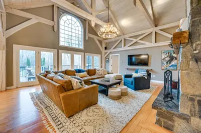 a living room with a couch and a fireplace at Monterey Home with Hot Tub, Pool and Game Room! in Monterey