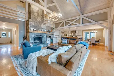 a living room with a couch and a fireplace at Monterey Home with Hot Tub, Pool and Game Room! in Monterey