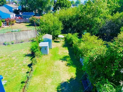 an aerial view of a garden with a bird house at Bright, Stylish & Cozy Private Attic Unit near NYC! in Haledon