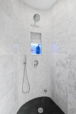 a bathroom with a shower with a black tub at 5 Star Gorgeous Cliffside Chalet with Panoramic Views in Tannersville