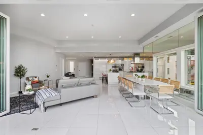 a large living room with a table and chairs at Piermont Waterfront Villa with Hot Tub in Piermont