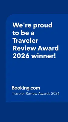 a blue sign that says were proud to be a traveler reviewagency winner at Poconos Chalet in Tobyhanna