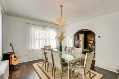 a dining room with a glass table and chairs at Charming Connecticut Retreat Near Museums and Hiking in Waterbury