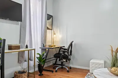 an office with a desk and a chair in a room at 1BR Apt Walk to Central Park and Columbia University in New York