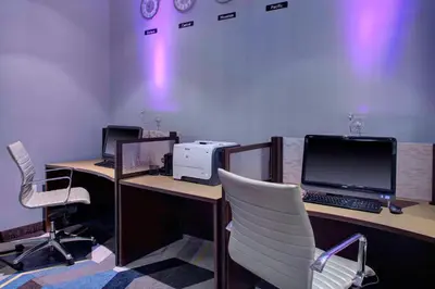 an office with two desks with a computer and a printer at HYATT House Shelton in Shelton