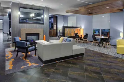 a living room with a couch and a fireplace at HYATT House Shelton in Shelton