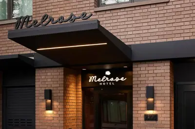 a maserati hotel sign on the side of a building at The Melrose Hotel in Bronx