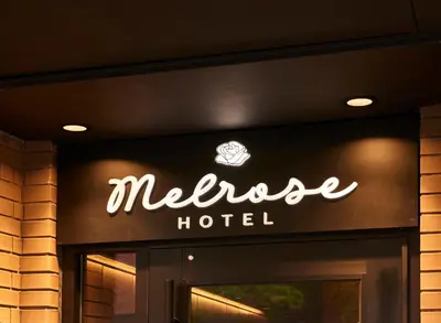 a sign on the door of a hotel at The Melrose Hotel in Bronx