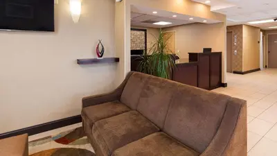 a couch in a waiting room in a hospital at Best Western Springfield West Inn in West Springfield