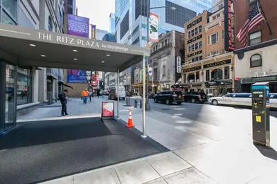 a city street with a sign for the ritz pizzeria at Theater District Studio w Indoor pool NYC-142 in New York