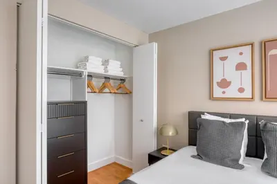 a bedroom with a bed and a closet at UWS 2br w gym doorman elevator nr Central Park NYC-1047 in New York