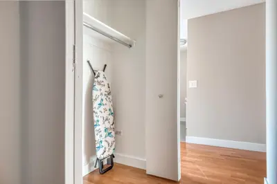 a hallway with white walls and a door with a pillow at UWS 2br w gym doorman elevator nr Central Park NYC-1047 in New York