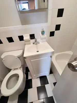 a bathroom with a toilet and a sink at Renovated 1br in East Village in New York