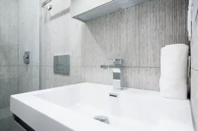 a bathroom with a white sink and a mirror at 180-2 Brand new 2BR 1Bath East Village in New York