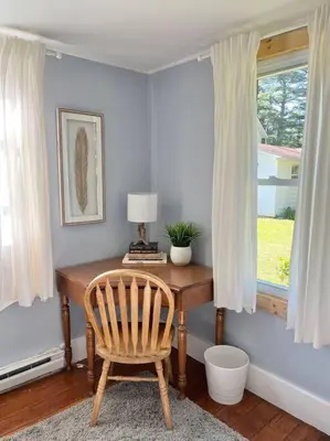 a desk with a chair in a room with a window at Catskills Quaint Cottage with Peloton Minutes from Hiking in Mount Tremper