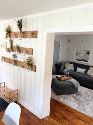 a living room with a couch and a table at Catskills Quaint Cottage with Peloton Minutes from Hiking in Mount Tremper