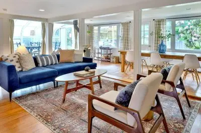 a living room with a blue couch and chairs at Catskills Country House with Hot Tub near River Trails in Mount Tremper