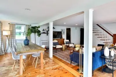 a living room with a table and a dining room at Catskills Country House with Hot Tub near River Trails in Mount Tremper