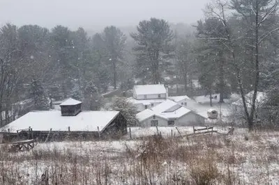 a group of houses covered in snow in a field at Catskills Country House with Hot Tub near River Trails in Mount Tremper