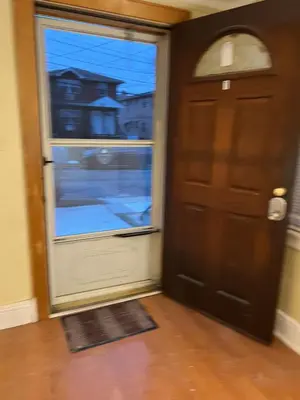 a door in a room with a window at 3 bedroom Queens Villgae in Bellerose Terrace
