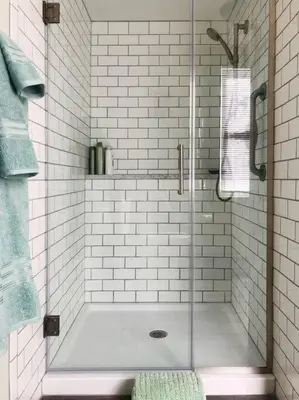 a shower with a glass door in a bathroom at Panther Mountain Lodge in Phoenicia