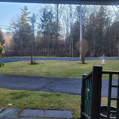 a park with a field of grass and a street at Panther Mountain Lodge in Phoenicia