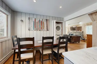 a kitchen and dining room with a table and chairs at Bear's Crossing Retreat in Dover