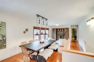 a dining room with a table and a couch at Secluded Catskill Home with Hiking Trails On-Site! in Catskill