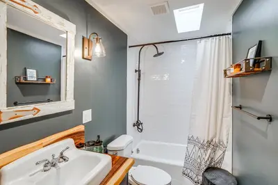 a bathroom with a sink and a toilet and a shower at Secluded Catskill Home with Hiking Trails On-Site! in Catskill