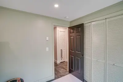 a walk in closet with a door and a hallway at Secluded Catskill Home with Hiking Trails On-Site! in Catskill