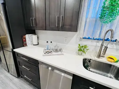 a kitchen with a sink and a dishwasher at Eleni’s Charming Studio in North Beach