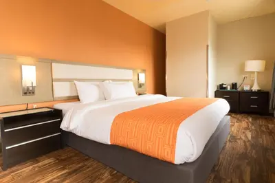 a large bed in a hotel room at Romana Hotel - NYC in Queens