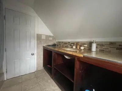a kitchen with a counter and a sink at Private Loft 5 min away from LGA in East Elmhurst