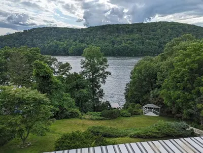 a view of a lake and a white gazebo at Candlewood Lake -Family Getaway, Lakefront 3775 sqft Home in Danbury