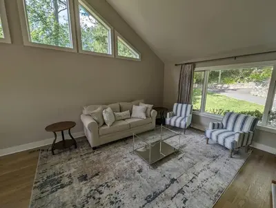 a living room with a couch and two chairs at Candlewood Lake -Family Getaway, Lakefront 3775 sqft Home in Danbury