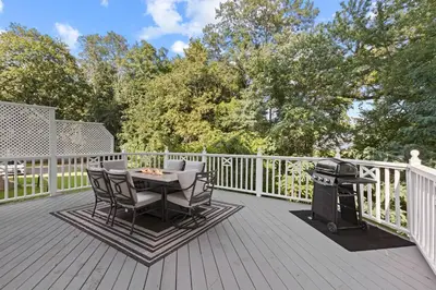 a deck with a grill and a table and chairs at Prime West Hartford Center Location- Historic Gem in West Hartford